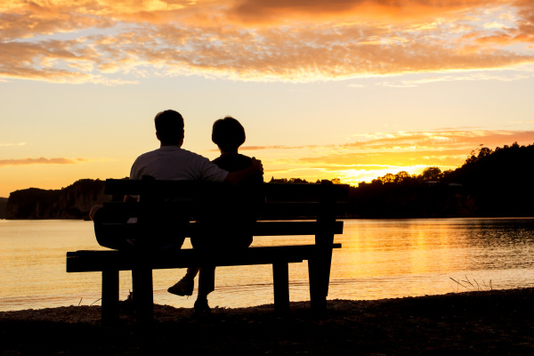 Couple sitting at bench